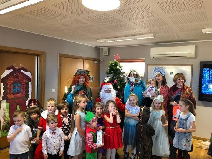 Children gathered for a festive classroom school event.