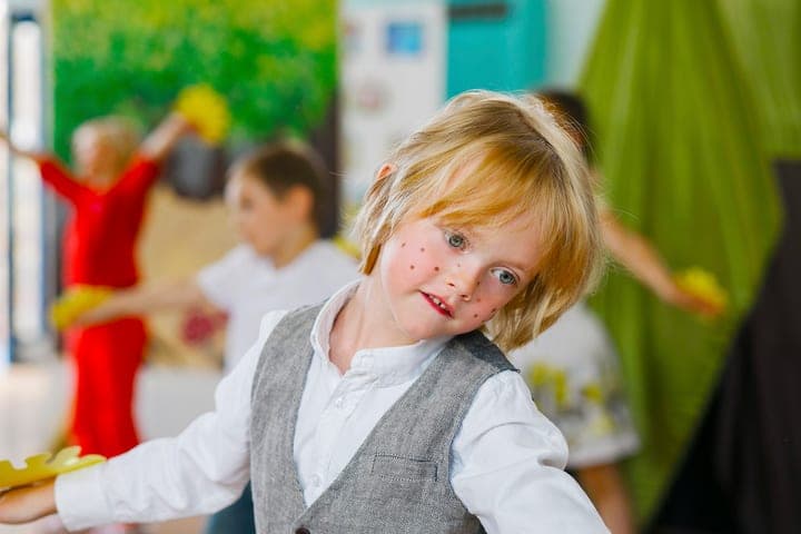 A child in costume during a school celebration.