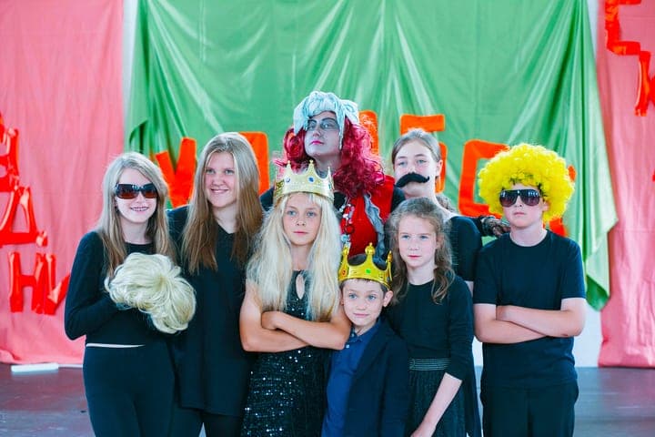 Students in costume posing together during a school event.