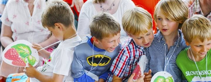Children taking part in a group book activity.