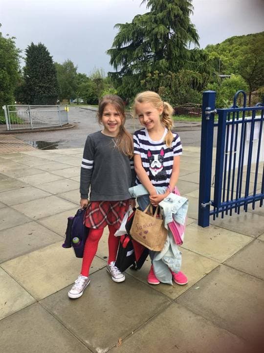 Children outside a school venue during an archive school day.