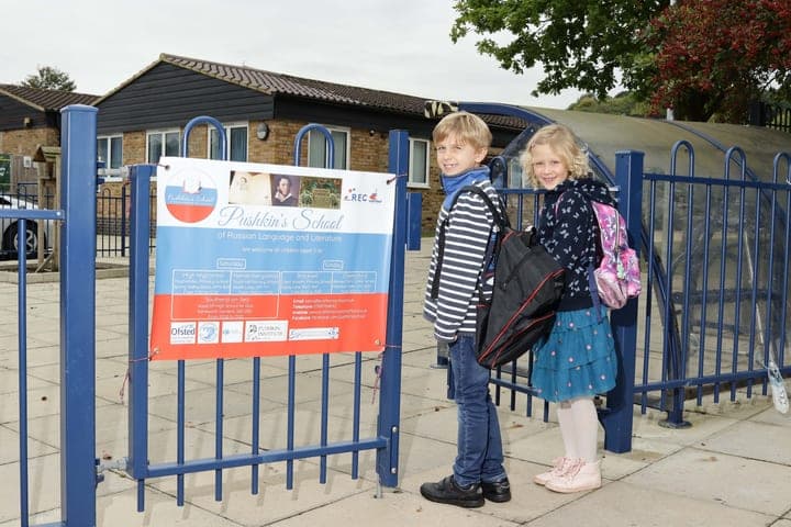 Families arriving near a High Wycombe school entrance.