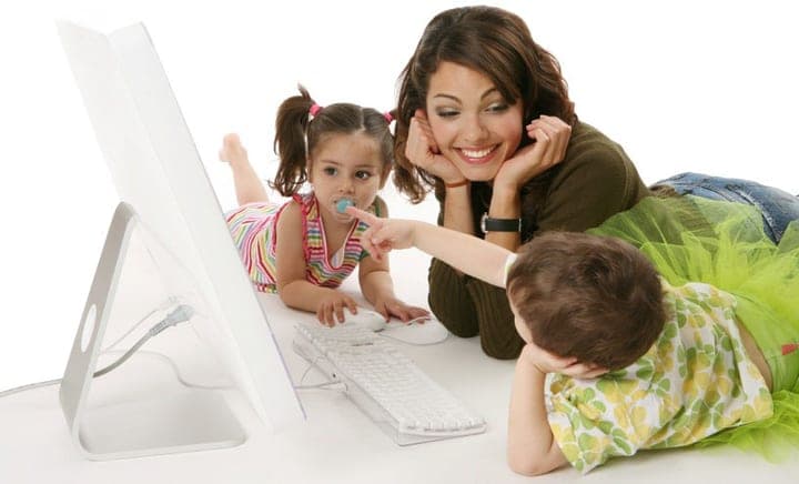 A teacher working with children in a legacy school image.