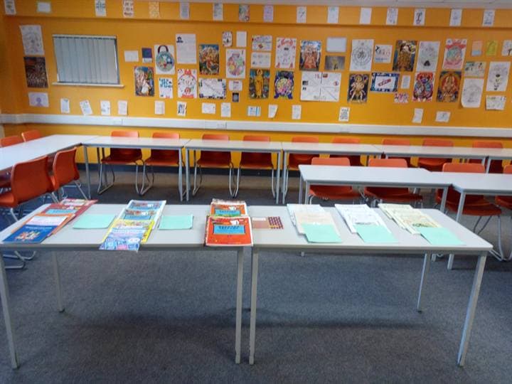 A classroom display and tables prepared for school activities.