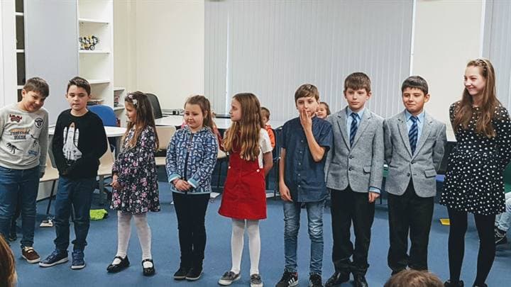 Children lined up during a school performance activity.