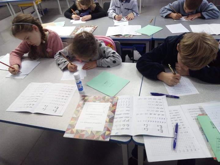Children taking part in a staged school activity.