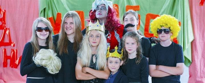Children in costume during a school performance archive moment.