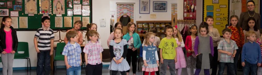 Children standing together during a school recital.