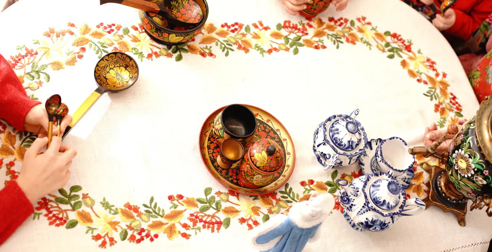 Cultural learning materials and crafts arranged on a table.