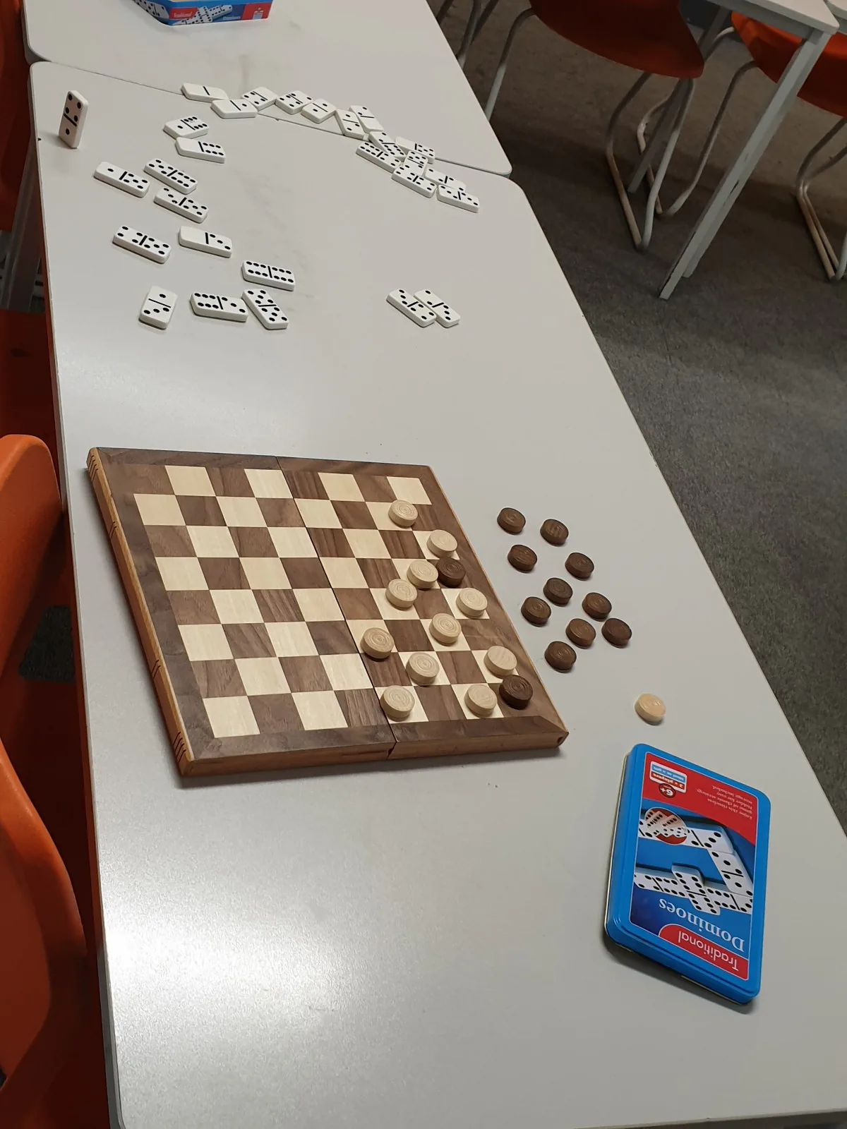 Learning materials arranged on a Russian school classroom table.